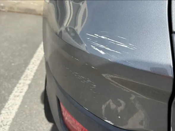Close-up of paint scuff repair work
